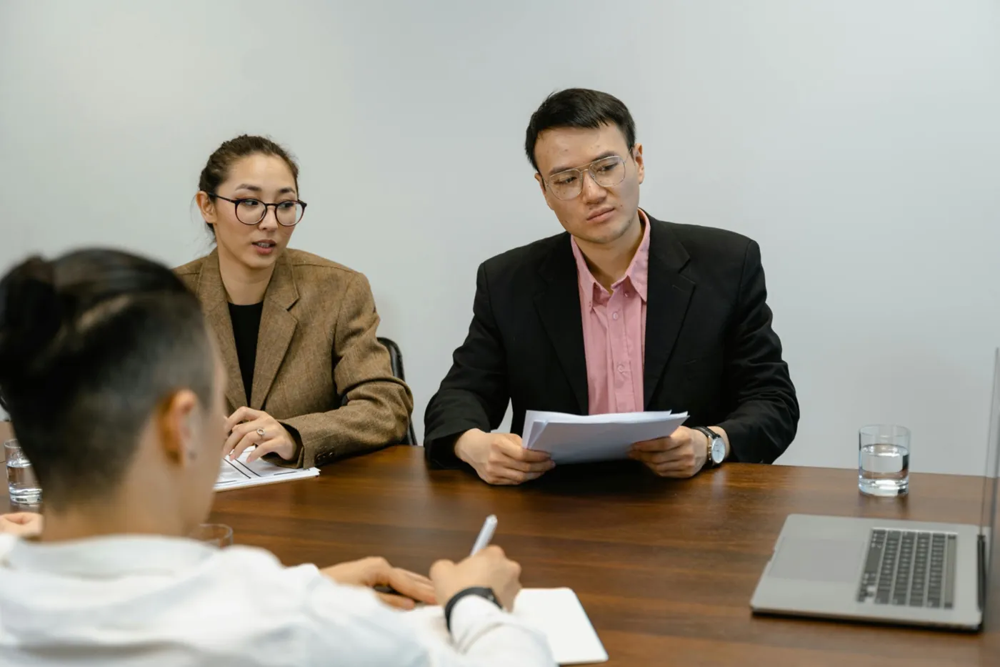 People at a table discussing secondment visas